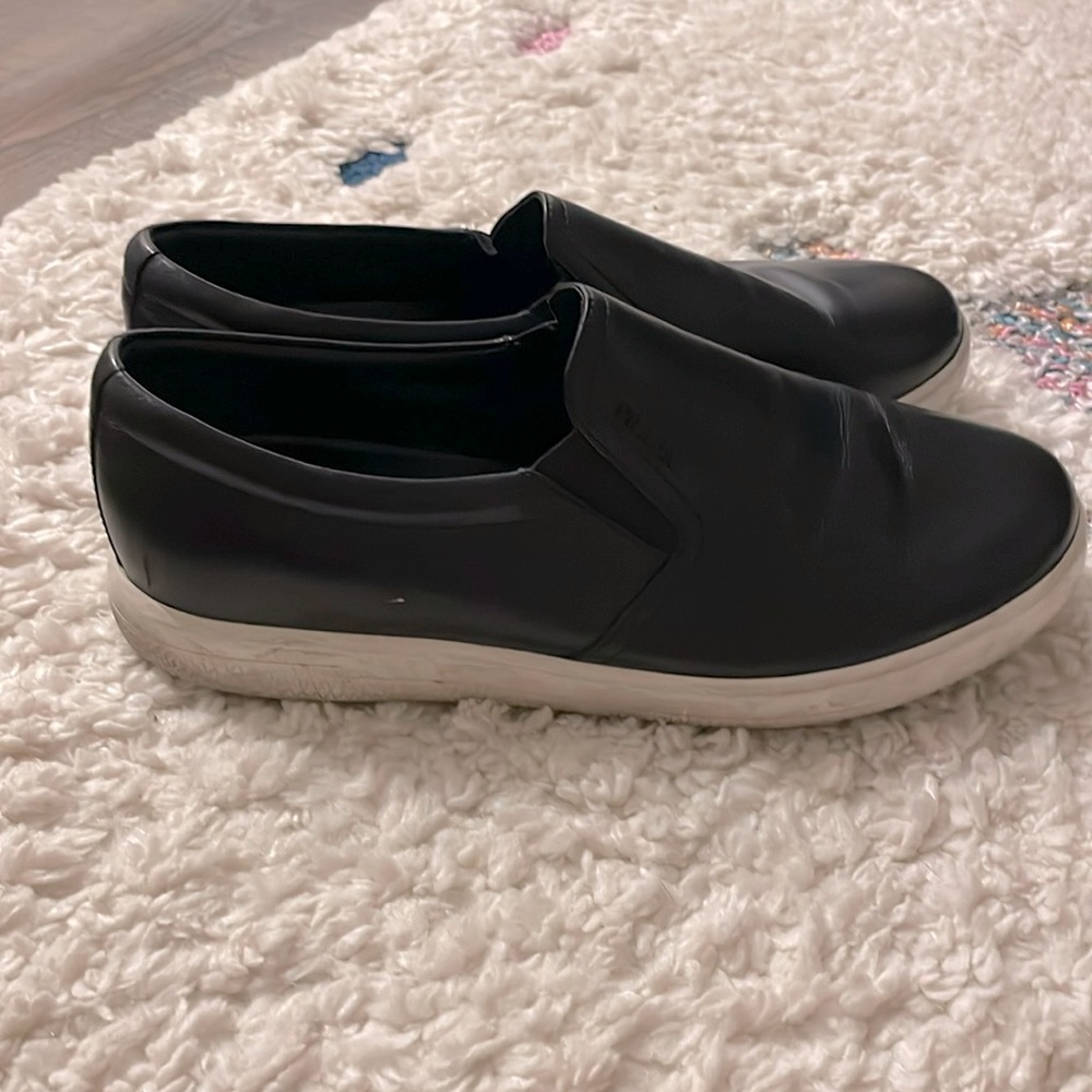 Prada loafers black white bottoms with res prada stripe